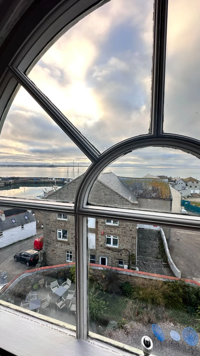 Arched window in Room 4 looking over the harbour