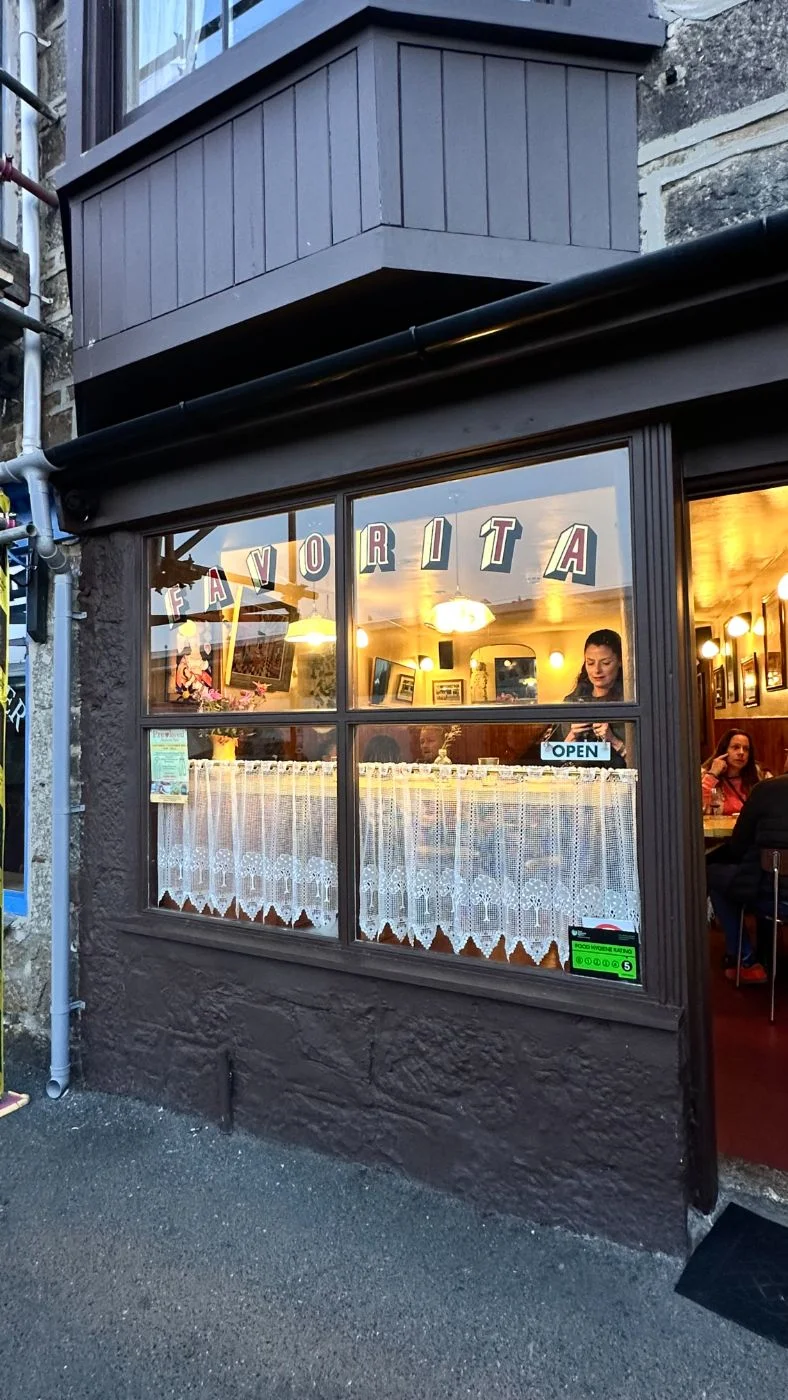 Favorita restaurant window at dusk