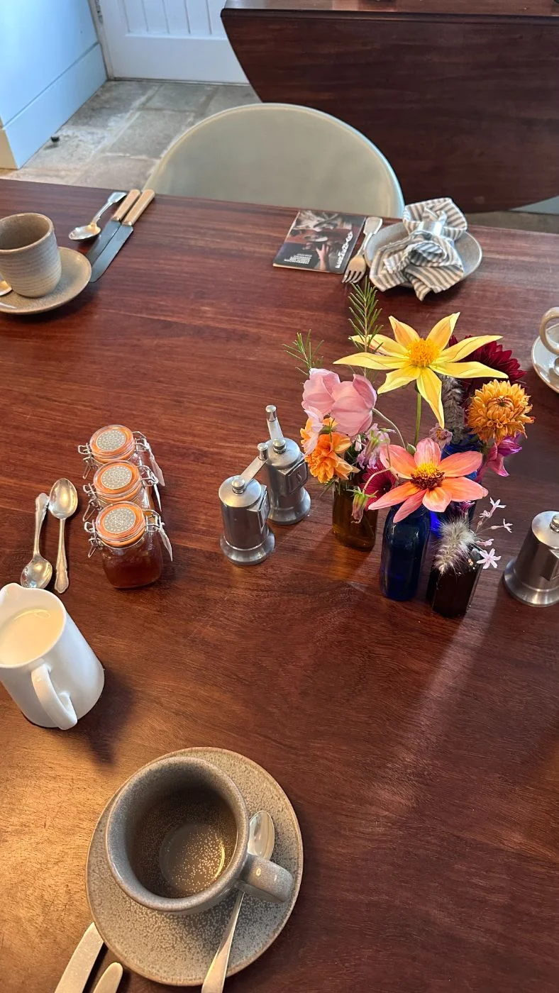 Breakfast table with flowers and Chapel House preserves