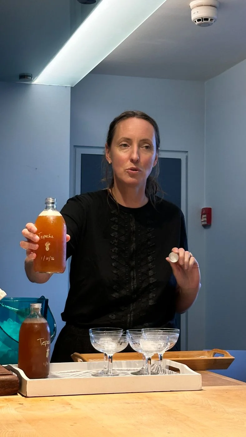 Rachel holding a bottle of tepache